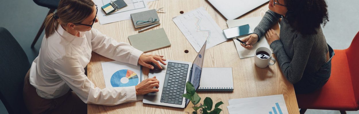 Two women freelancer working together in modern coworking. Teamwork concept. High quality photo